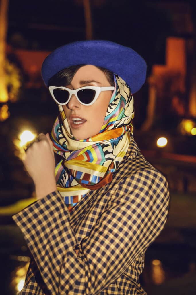 White tigers scarf - Woman wearing a green and ivory scarf from brand Marylène Madou